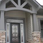 Unique entryway with beautiful door and side panes