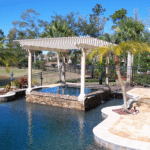 Lattice on patio and covering hot tub with lake
