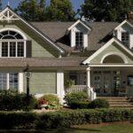 Home with green shake siding