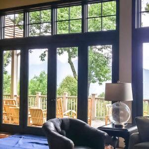 Large Multi-pane window looking out to wood deck